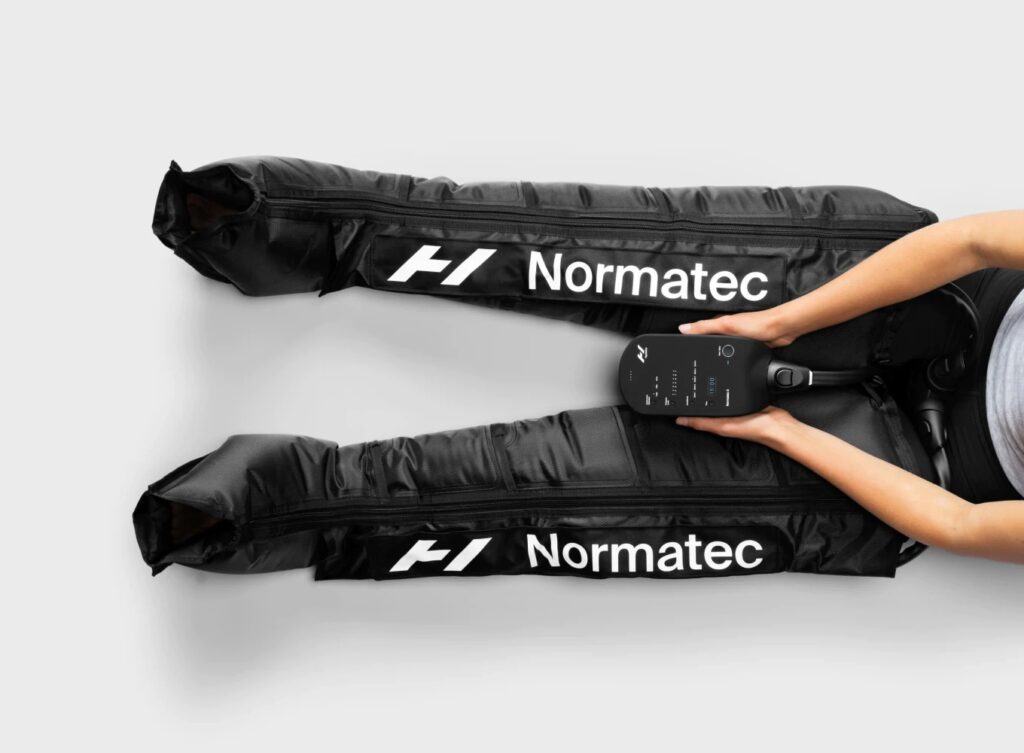 Portable Normatec 3 compression therapy system with leg attachment available for hire in the UK, perfect for sports recovery, improving circulation, and flushing toxins faster than standard massage for athletes and fitness recovery seekers.”