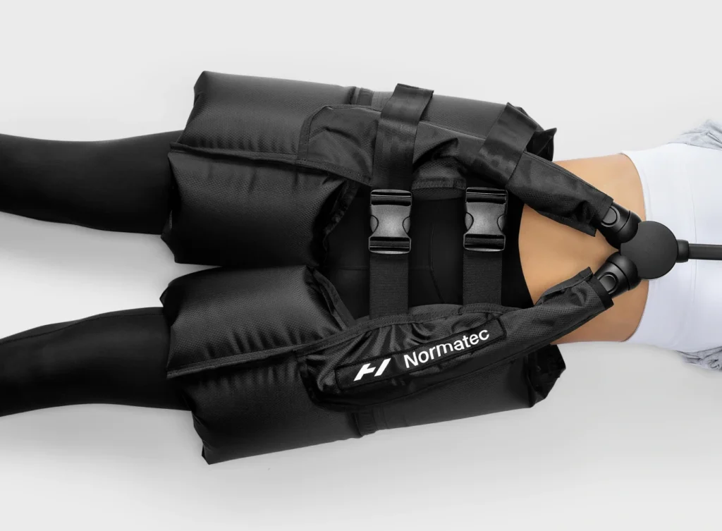 Portable Normatec 3 compression therapy system with hip attachment available for hire in the UK, perfect for sports recovery, improving circulation, and flushing toxins faster than standard massage for athletes and fitness recovery seekers.