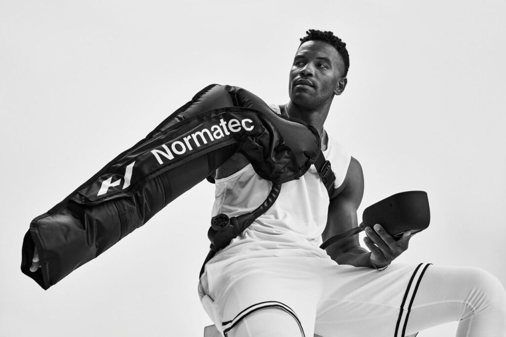 Portable Normatec 3 compression therapy system with arm attachment available for hire in the UK, perfect for sports recovery, improving circulation, and flushing toxins faster than standard massage for athletes and fitness recovery seekers.