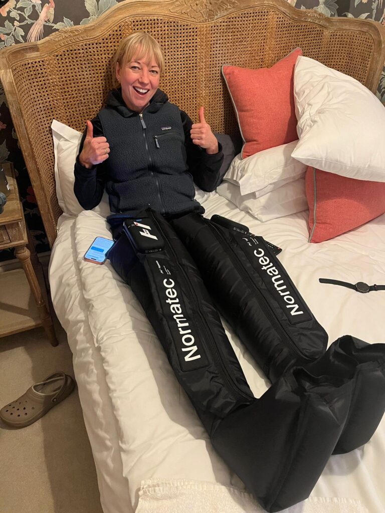 Sara Cox using Normatec compression boots from Pro Sports Recovery to recover after another marathon during her 5 marathons in 5 days BBC Children in Need challenge